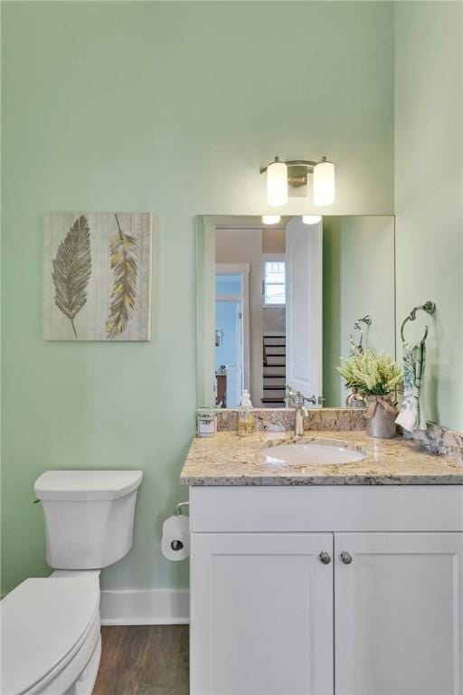 5525 Fontana Ct, Murrysville, PA 15632 - bathroom with toilet, baseboards, vanity, and wood finished floors