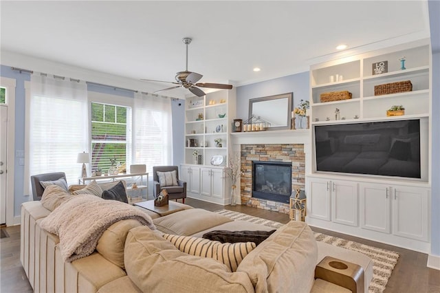 5525 Fontana Ct, Murrysville, PA 15632 - living room with wood finished floors, a fireplace, ceiling fan, built in shelves, and recessed lighting