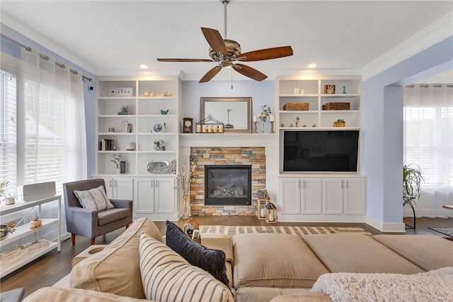 5525 Fontana Ct, Murrysville, PA 15632 - living room with ceiling fan, a stone fireplace, crown molding, wood finished floors, and recessed lighting