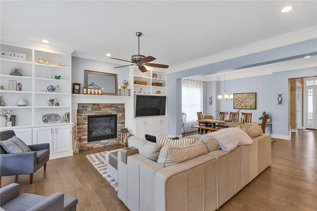 5525 Fontana Ct, Murrysville, PA 15632 - living area with crown molding, plenty of natural light, wood finished floors, a fireplace, and recessed lighting