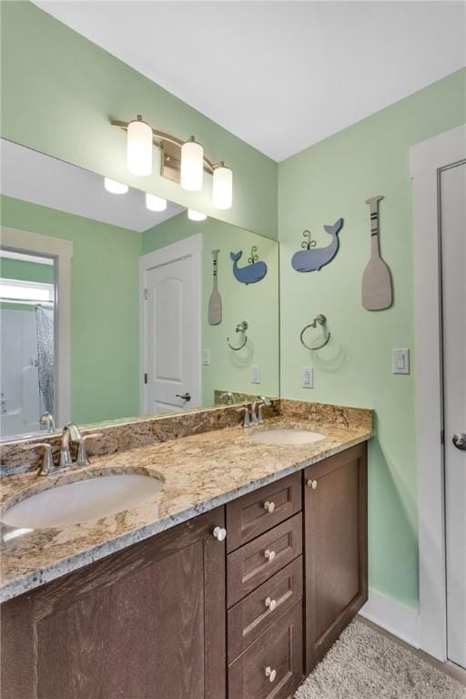 5525 Fontana Ct, Murrysville, PA 15632 - full bathroom featuring double vanity and baseboards