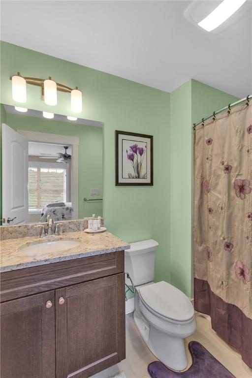 5525 Fontana Ct, Murrysville, PA 15632 - full bathroom with vanity, toilet, tile patterned floors, and a shower with shower curtain