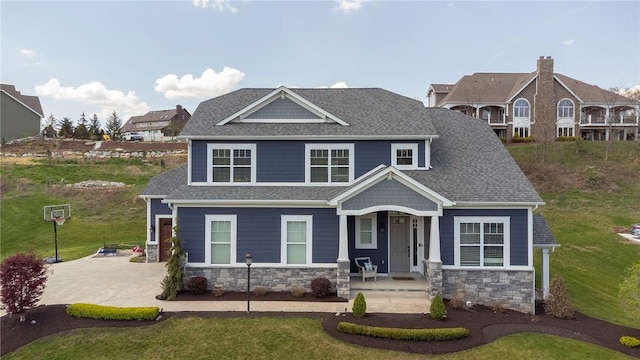 5525 Fontana Ct, Murrysville, PA 15632 - view of front of home featuring covered porch, stone siding, roof with shingles, and a front yard