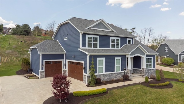 5525 Fontana Ct, Murrysville, PA 15632 - craftsman-style house featuring driveway, stone siding, a front yard, and a shingled roof