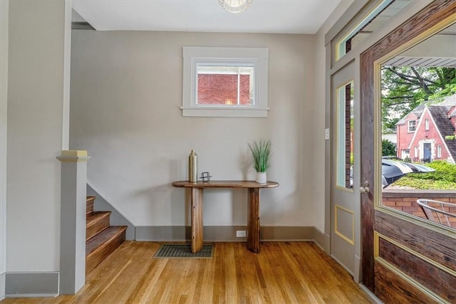 212 Orchard Pl, Sewickley, PA 15143 - entrance foyer with light wood-style floors, stairs, and baseboards