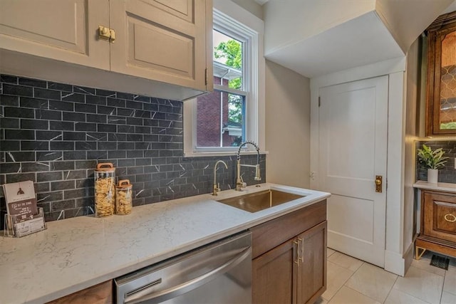 212 Orchard Pl, Sewickley, PA 15143 - kitchen with dishwasher, a sink, backsplash, light tile patterned flooring, and light stone countertops