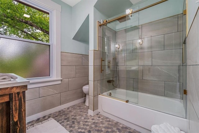 212 Orchard Pl, Sewickley, PA 15143 - bathroom featuring toilet, tile walls, and enclosed tub / shower combo