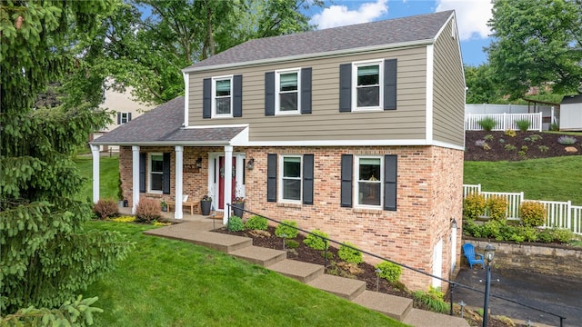 161 Ridgeview Dr, Mccandless, PA 15090 - view of front of property featuring brick siding, asphalt driveway, an attached garage, and a porch