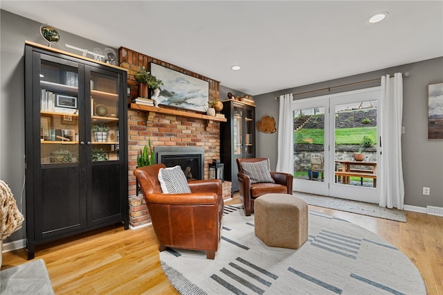 161 Ridgeview Dr, Mccandless, PA 15090 - living room with light wood-type flooring, baseboards, a brick fireplace, and recessed lighting