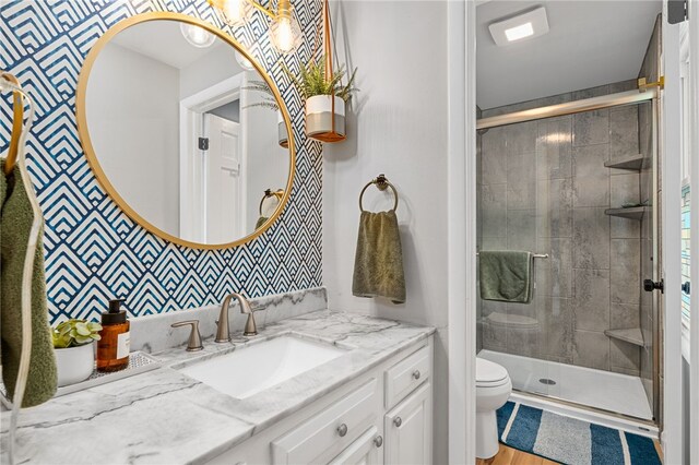 161 Ridgeview Dr, Mccandless, PA 15090 - bathroom with toilet, vanity, a shower stall, and wallpapered walls