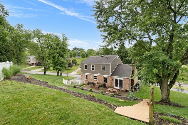 161 Ridgeview Dr, Mccandless, PA 15090 - back of house featuring a patio area, a shingled roof, and view of scattered trees