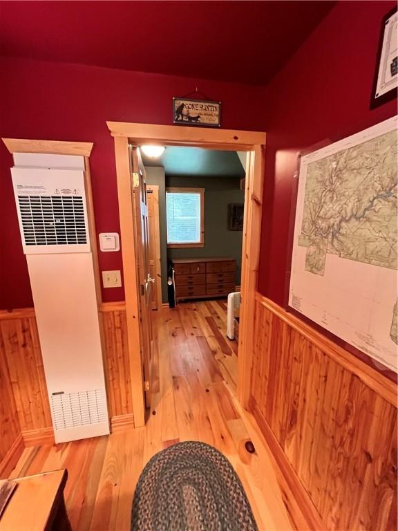 351 2nd Ave, North-Other Area, PA 16353 - hall featuring a heating unit, wainscoting, light wood-style flooring, and wood walls