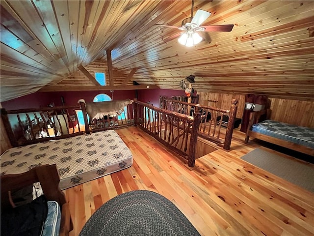 351 2nd Ave, North-Other Area, PA 16353 - bedroom featuring vaulted ceiling, hardwood / wood-style flooring, and wood walls