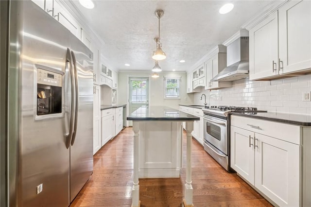 324 Orwell Way, Bloomfield, PA 15224 - kitchen with appliances with stainless steel finishes, wall chimney exhaust hood, a sink, dark countertops, and crown molding