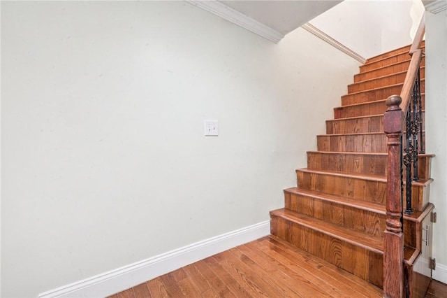 324 Orwell Way, Bloomfield, PA 15224 - staircase with baseboards, wood finished floors, and crown molding