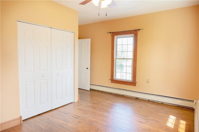322 Garfield Ave, Mars Boro, PA 16046 - unfurnished bedroom with a baseboard radiator, a closet, light wood-style floors, and a ceiling fan