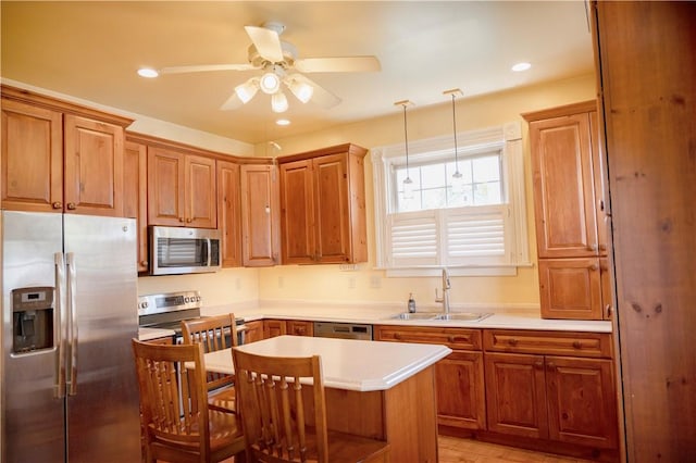 322 Garfield Ave, Mars Boro, PA 16046 - kitchen featuring stainless steel appliances, a sink, ceiling fan, brown cabinets, and recessed lighting
