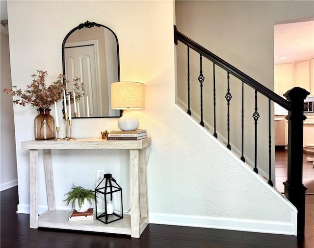 112 Brandywine, Manor, PA 15642 - stairs with baseboards and wood finished floors