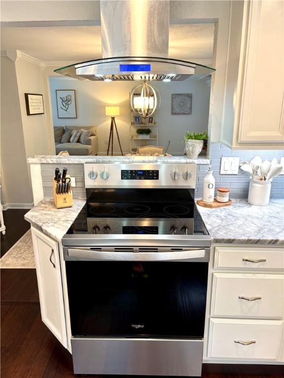 112 Bandywine, Penn Twp Wml, PA 15642 - kitchen featuring stainless steel electric stove, range hood, white cabinetry, dark wood-style flooring, and ornamental molding