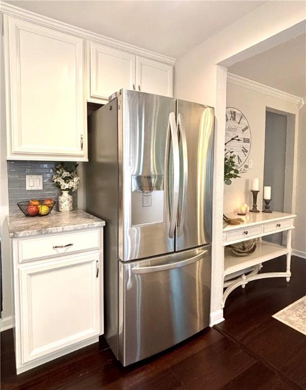 112 Bandywine, Penn Twp Wml, PA 15642 - kitchen with stainless steel fridge, dark wood-style floors, white cabinets, and decorative backsplash