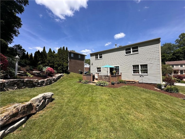 112 Brandywine, Manor, PA 15642 - back of property with a deck and a yard