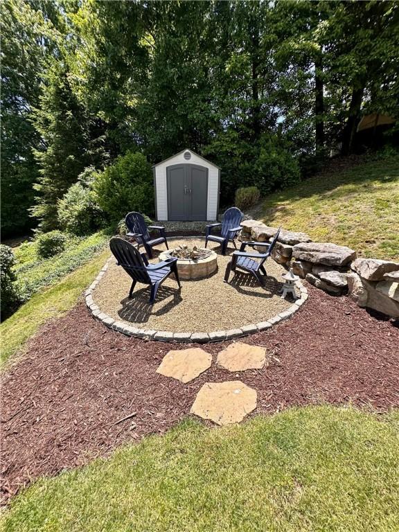 112 Brandywine, Manor, PA 15642 - view of yard featuring an outdoor fire pit and a patio