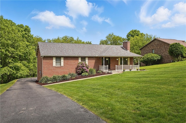 465 Hewitt Ave, Canton Twp, PA 15301 - single story home featuring a porch, a chimney, brick siding, and a front lawn
