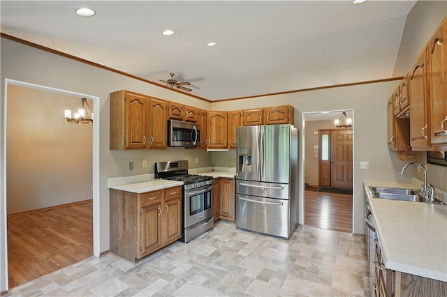 465 Hewitt Ave, Canton Twp, PA 15301 - kitchen with stainless steel appliances, a sink, a chandelier, brown cabinetry, and light countertops
