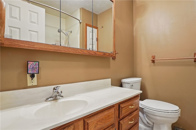 465 Hewitt Ave, Canton Twp, PA 15301 - full bathroom with toilet, vanity, a shower, and a textured ceiling