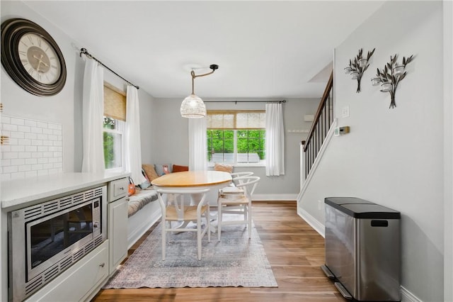 471 Filmore Rd, Forest Hills Boro, PA 15221 - dining space with baseboards, light wood-type flooring, and stairway
