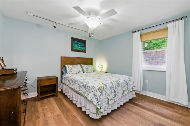 471 Filmore Rd, Forest Hills Boro, PA 15221 - bedroom featuring baseboards, wood finished floors, track lighting, and a ceiling fan