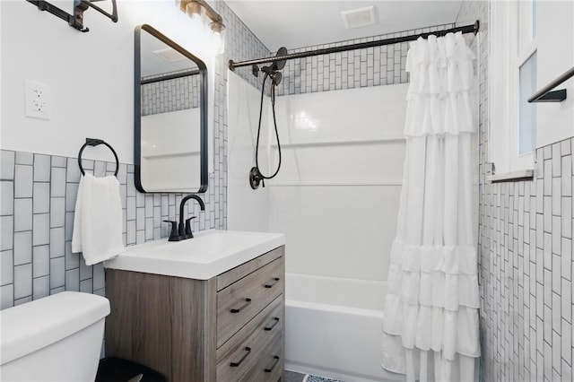 471 Filmore Rd, Forest Hills Boro, PA 15221 - bathroom featuring tile walls, vanity, toilet, and shower / tub combo with curtain
