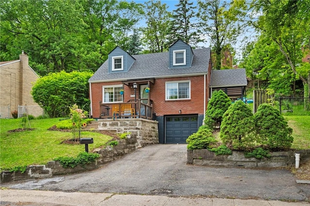 471 Filmore Rd, Forest Hills Boro, PA 15221 - new england style home featuring a garage, driveway, brick siding, roof with shingles, and covered porch
