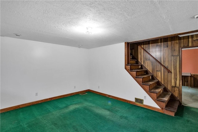 208 Maple Ave, City Of But Se, PA 16001 - finished basement with stairway, carpet, baseboards, and a textured ceiling