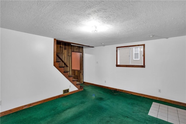 208 Maple Ave, City Of But Se, PA 16001 - finished below grade area featuring baseboards, stairway, carpet, and a textured ceiling