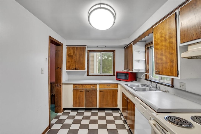 208 Maple Ave, City Of But Se, PA 16001 - kitchen with dishwasher, a sink, light countertops, tile patterned floors, and brown cabinets