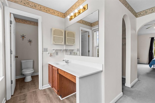 300 Green Flds, Cranberry Twp, PA 16066 - bathroom with vanity, toilet, baseboards, and wood finished floors