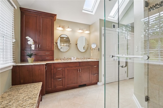 2536 Appletree Dr, Upper St Clair, PA 15241 - bathroom with a skylight, double vanity, a shower stall, lofted ceiling, and tile patterned floors