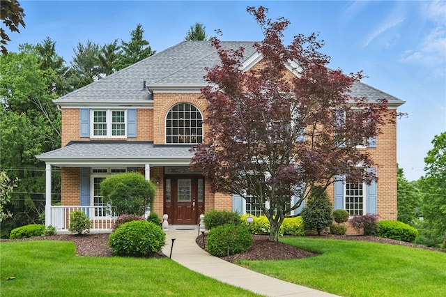 2536 Appletree Dr, Upper St Clair, PA 15241 - traditional home featuring brick siding, a shingled roof, a front lawn, and a porch