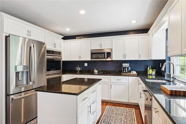 2536 Appletree Dr, Upper St Clair, PA 15241 - kitchen featuring appliances with stainless steel finishes, a sink, white cabinets, and recessed lighting