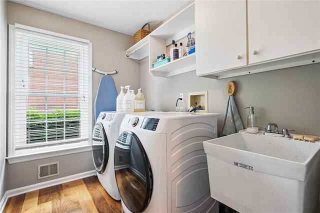 2536 Appletree Dr, Upper St Clair, PA 15241 - laundry room with cabinet space, light wood-style floors, baseboards, and washing machine and clothes dryer