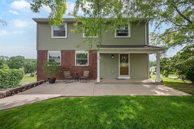 53 Escalon Dr, Findlay Twp, PA 15108 - rear view of property featuring a yard, brick siding, and a patio area