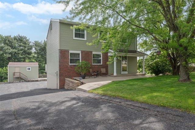 53 Escalon Dr, Findlay Twp, PA 15108 - view of front of home with brick siding and a front lawn