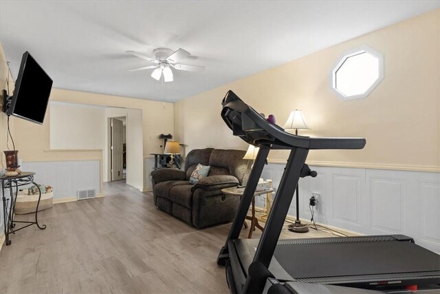 53 Escalon Dr, Findlay Twp, PA 15108 - exercise area featuring a ceiling fan, light wood finished floors, a decorative wall, and wainscoting
