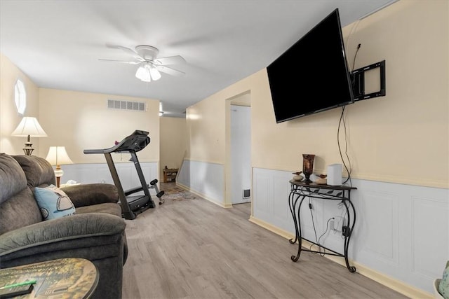 53 Escalon Dr, Findlay Twp, PA 15108 - living room featuring ceiling fan, wainscoting, and light wood-type flooring