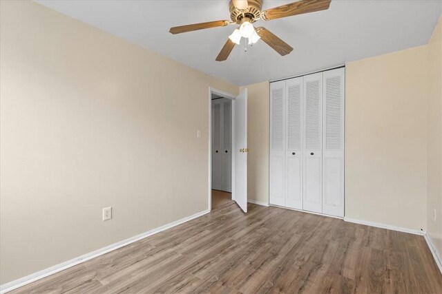 53 Escalon Dr, Findlay Twp, PA 15108 - unfurnished bedroom with wood finished floors, a closet, baseboards, and ceiling fan