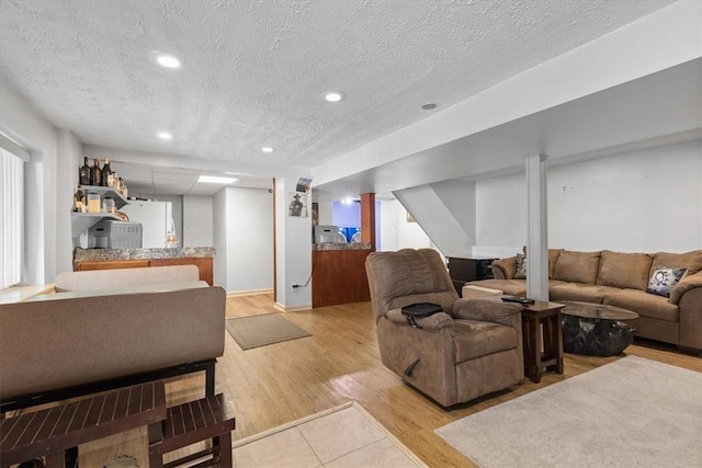 53 Escalon Dr, Findlay Twp, PA 15108 - living area with a textured ceiling, recessed lighting, light wood-style floors, and stairway