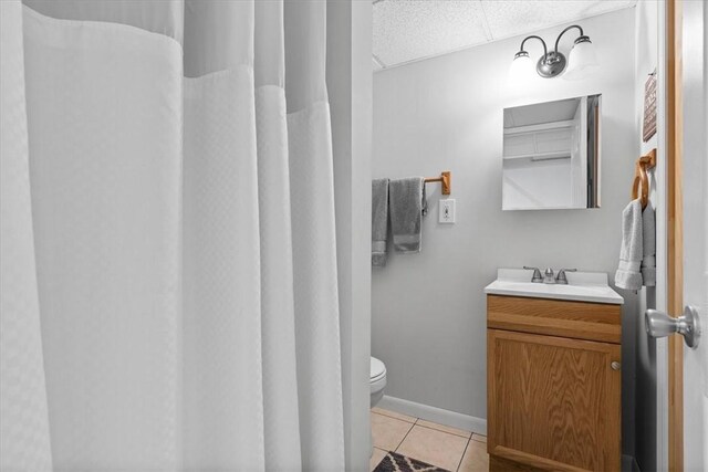53 Escalon Dr, Findlay Twp, PA 15108 - bathroom with tile patterned flooring, vanity, toilet, and a drop ceiling