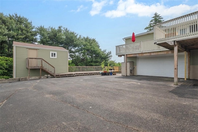 53 Escalon Dr, Findlay Twp, PA 15108 - view of parking featuring a garage and asphalt driveway