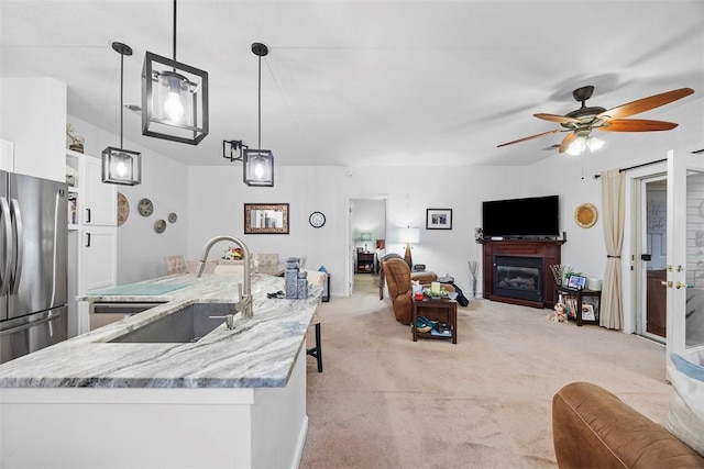 200 Hidden Ridge Ct Unit 202, South Park, PA 15129 - kitchen featuring a sink, white cabinetry, light carpet, ceiling fan, and freestanding refrigerator